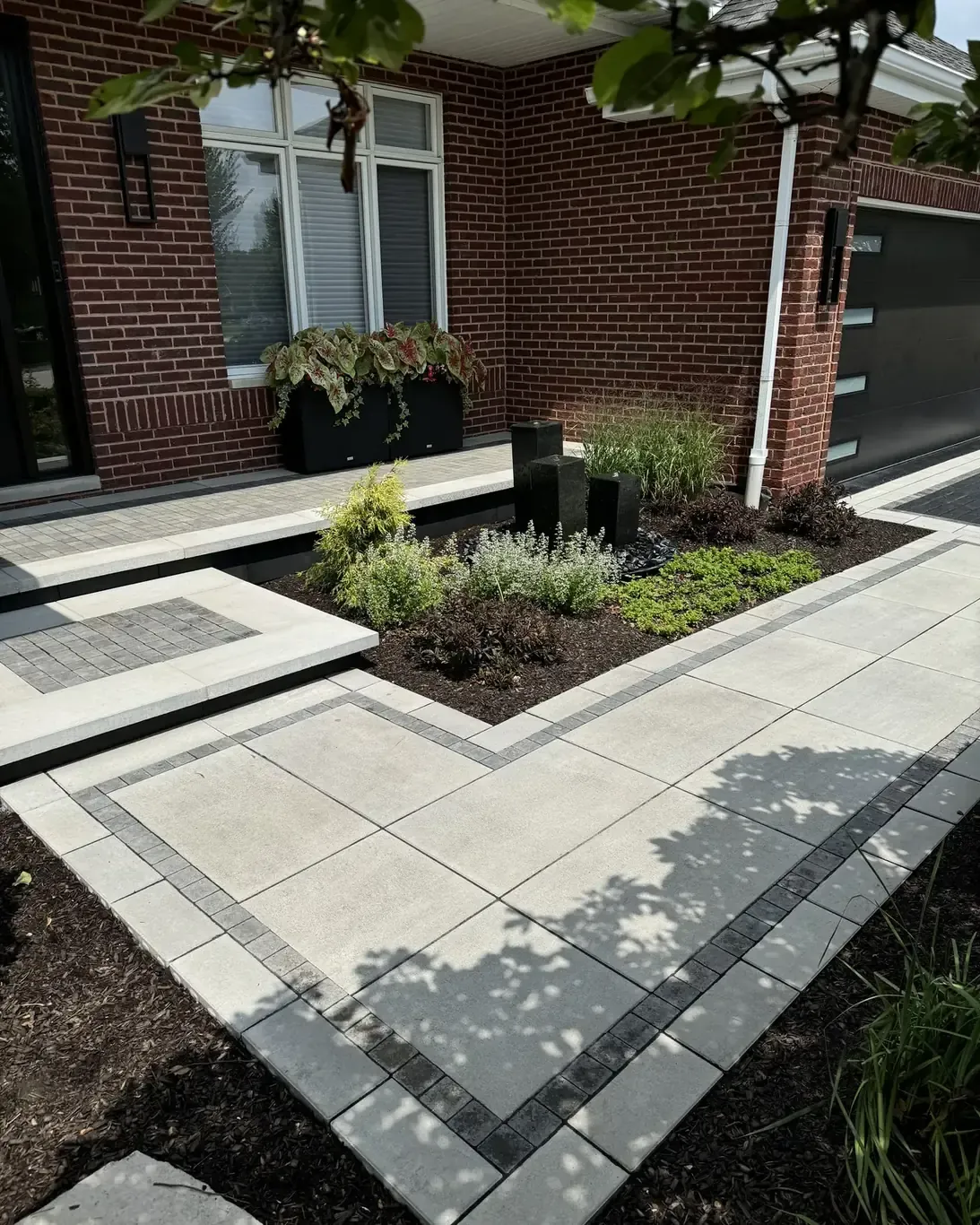 Finished paver driveways in Frankfort by Rodak Landscaping: Frankfort Paver Driveway with Charcoal Accent Border