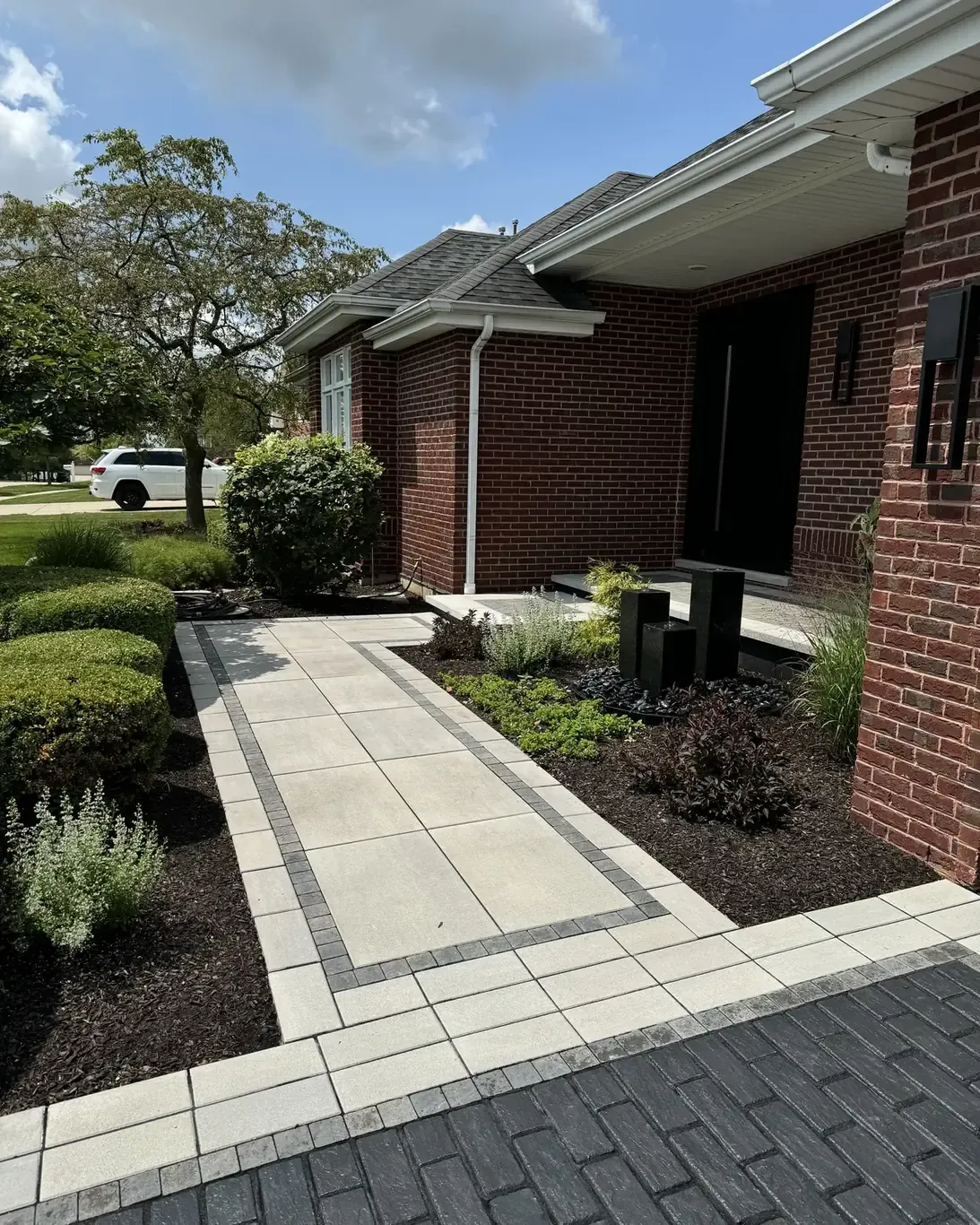 Finished paver driveways in Frankfort by Rodak Landscaping: Frankfort Paver Driveway with Charcoal Accent Border