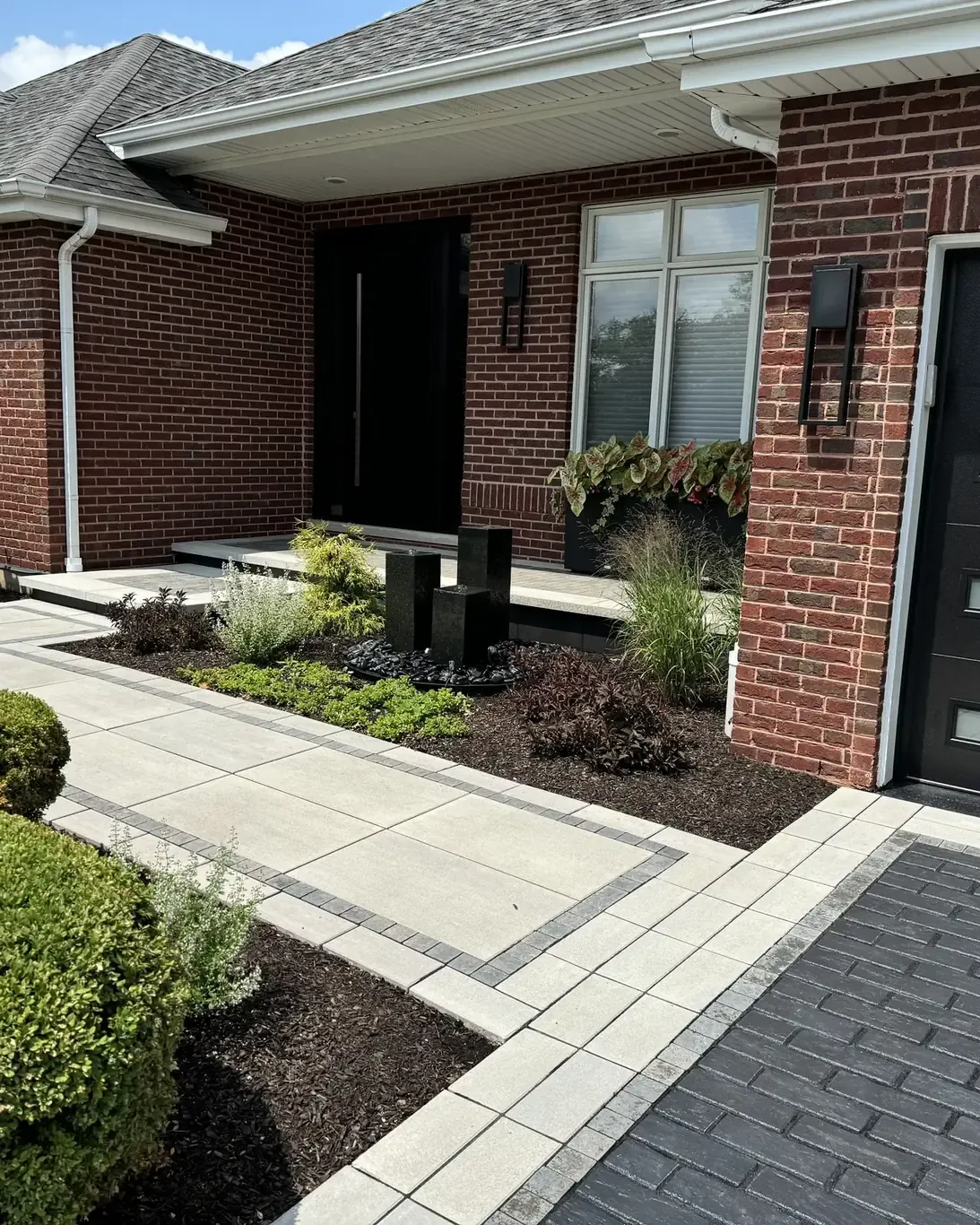 Finished paver driveways in Frankfort by Rodak Landscaping: Frankfort Paver Driveway with Charcoal Accent Border
