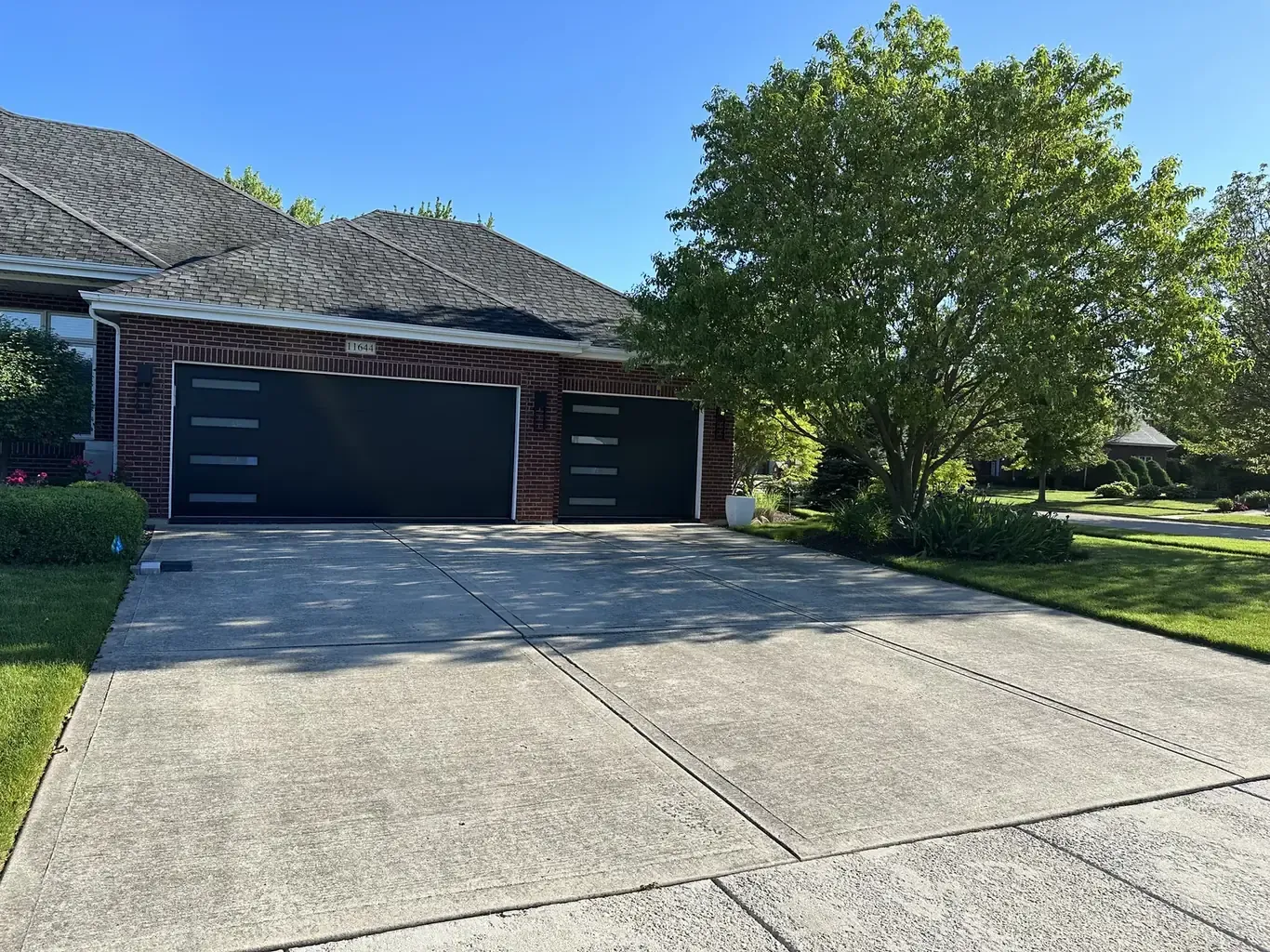 Before: Frankfort Paver Driveway with Charcoal Accent Border by Rodak Landscaping
