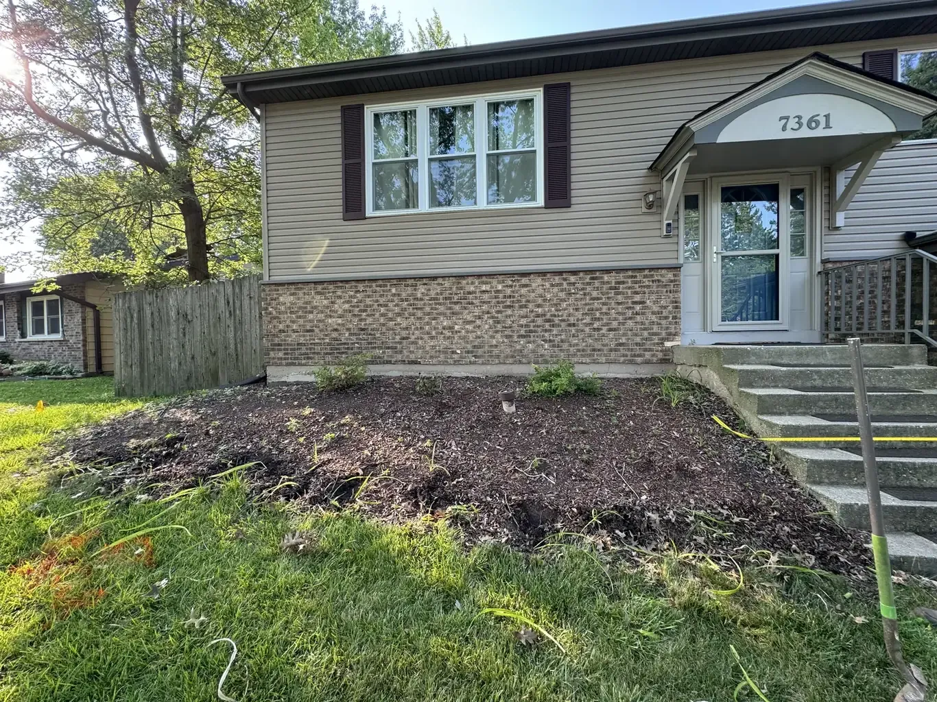 Retaining Walls in Frankfort before Rodak Landscaping started: Frankfort Tiered Retaining Wall with Paver Walkway