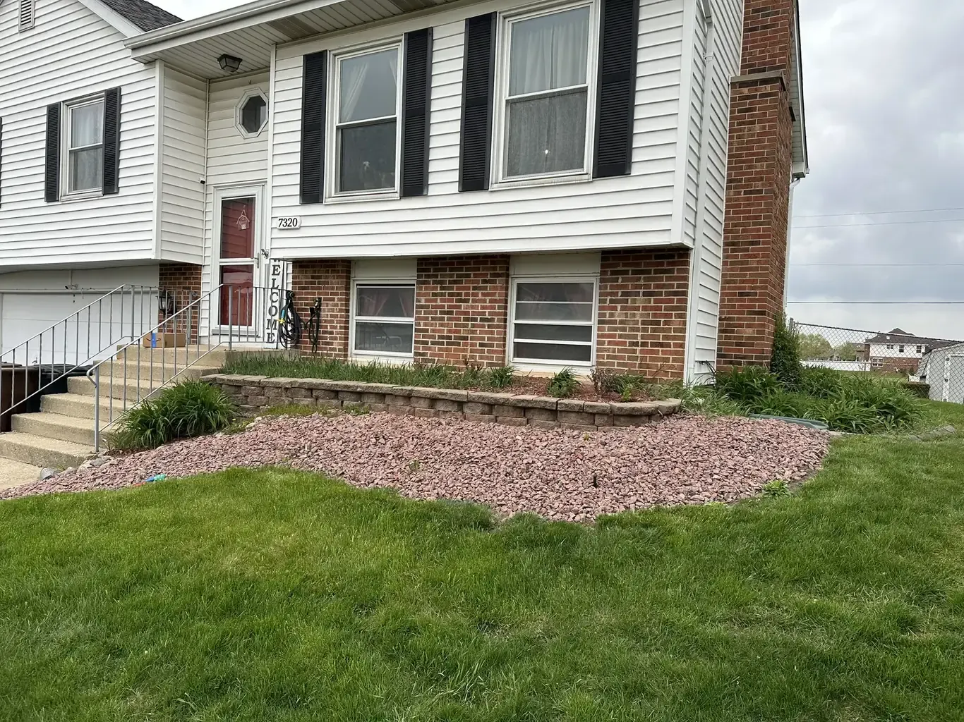 Before: Frankfort Modern Front Yard with Curving Tiered Wall by Rodak Landscaping