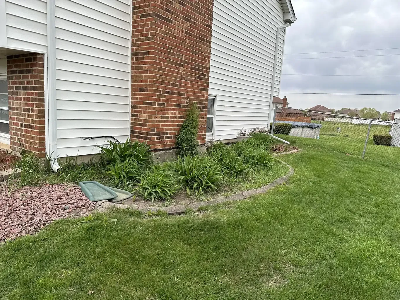 Retaining Walls in Frankfort before Rodak Landscaping started: Frankfort Modern Front Yard with Curving Tiered Wall