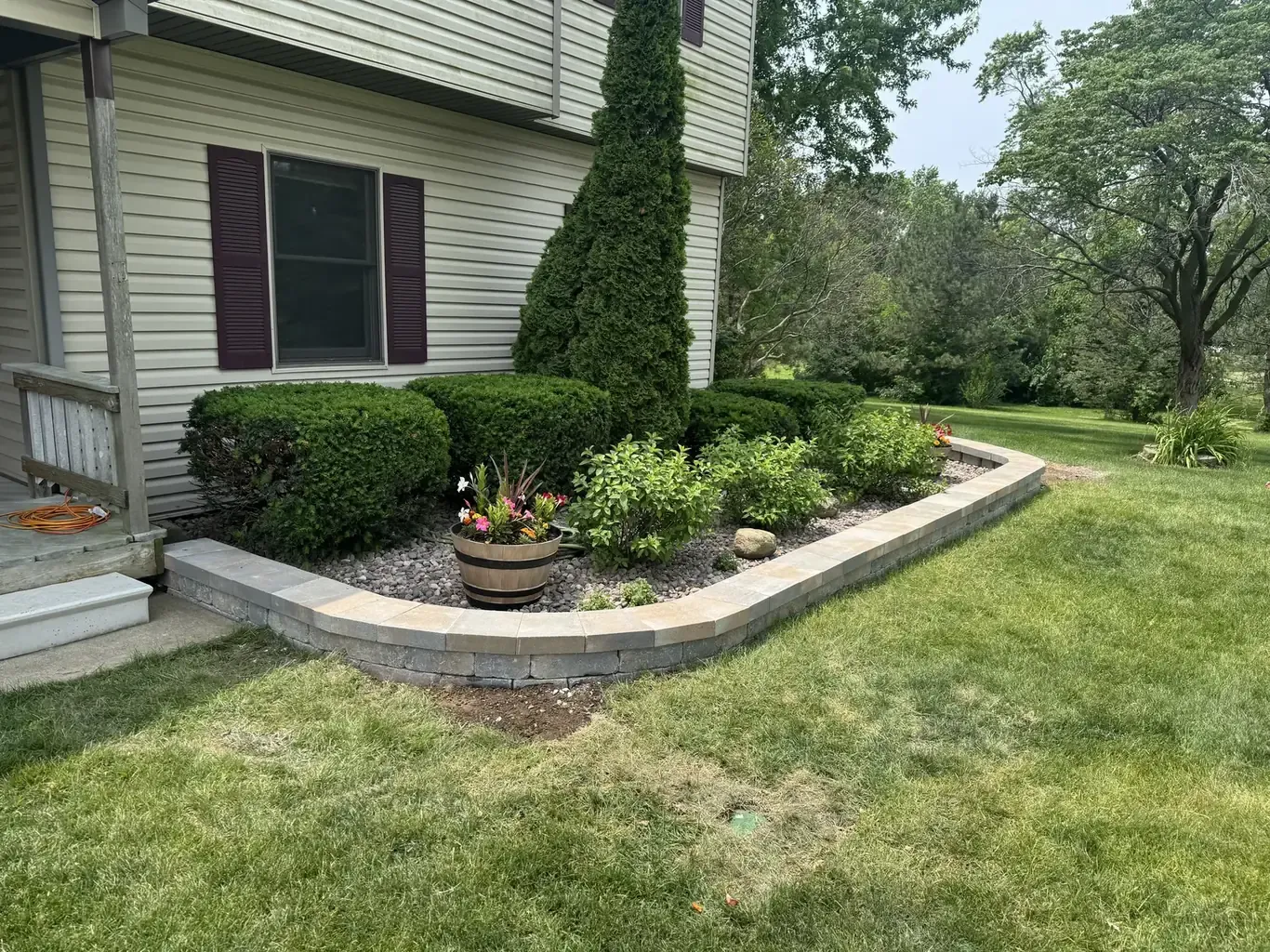 After: Frankfort Stone Wall & Above-Ground Pool Surround by Rodak Landscaping