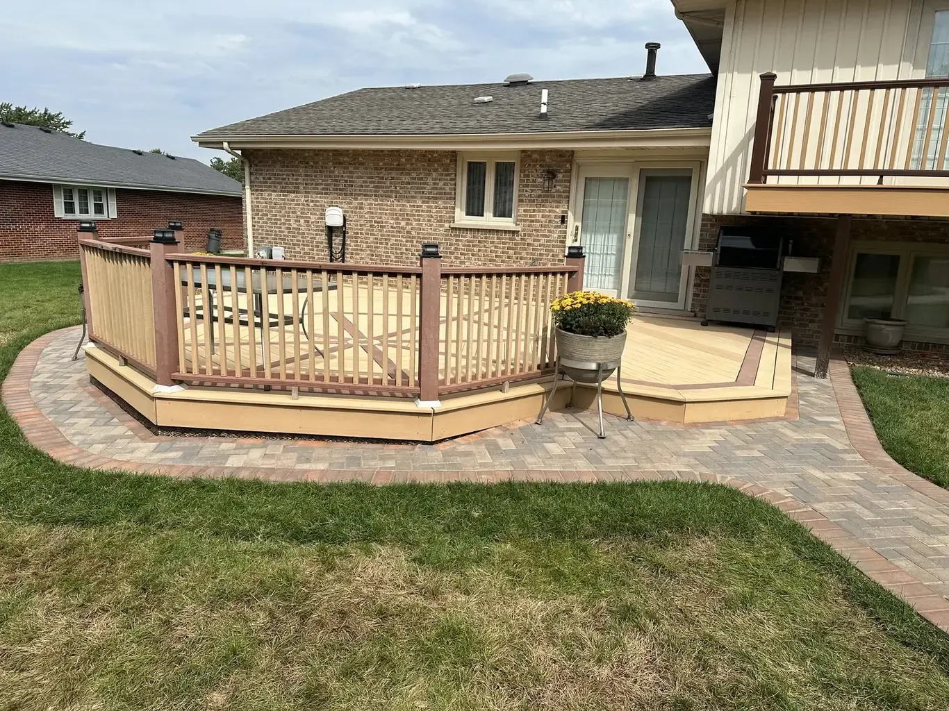 Composite deck and paver patio outdoor living space ready for a pergola, by Rodak Landscaping in Homer Glen