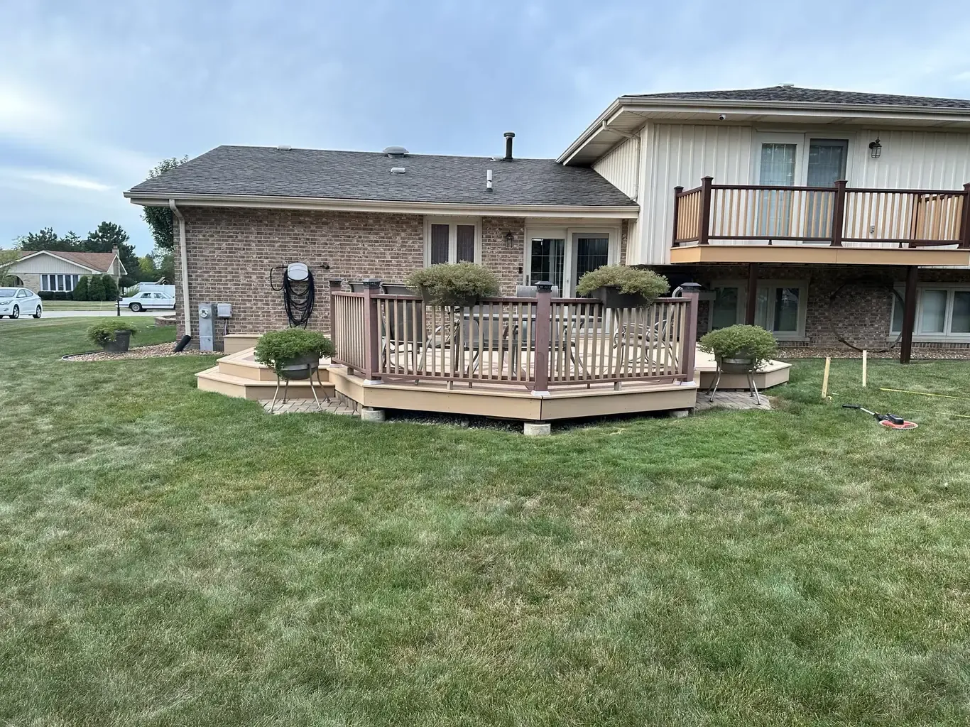 Before: Homer Glen Fire Pit Patio with Curved Seating Wall by Rodak Landscaping