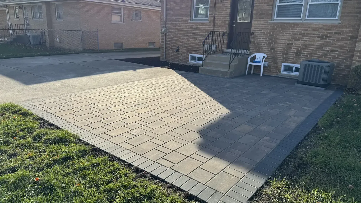 Open paver patio suited to a pergola or shade structure, built by Rodak Landscaping in Lemont