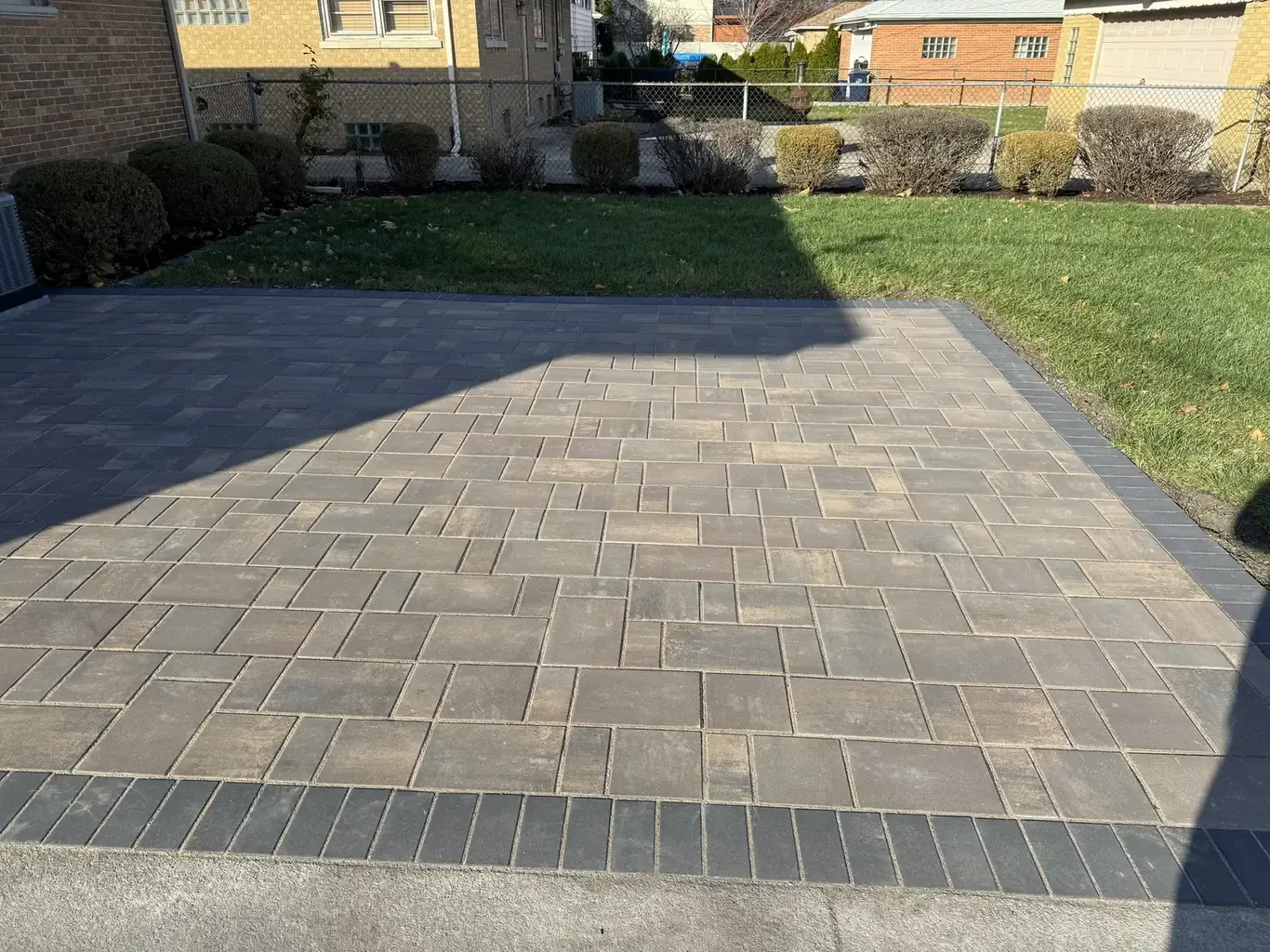 Finished paver patios in Lemont by Rodak Landscaping: Lemont Backyard Paver Patio Installation