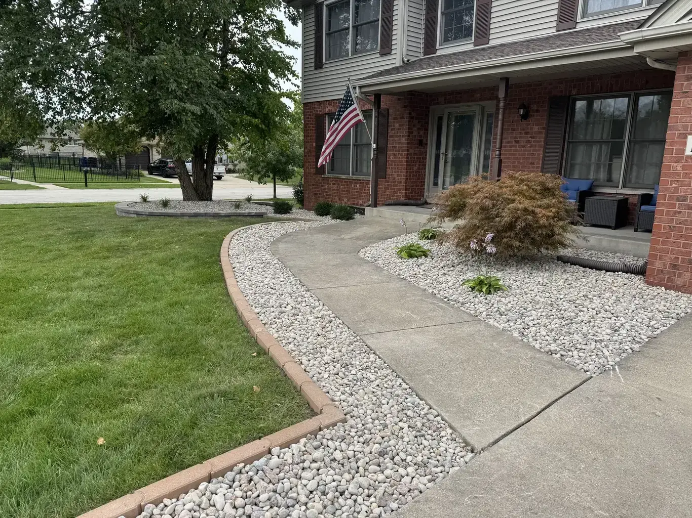 Finished landscape design in Mokena by Rodak Landscaping: Mokena Front Yard Refresh with Paver Edging