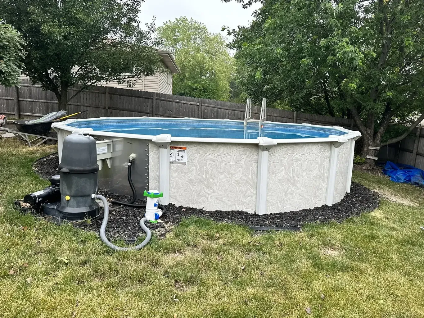 Pool Patios & Surrounds in the southwest suburbs before Rodak Landscaping started: Above-Ground Pool with Paver-Edged Gravel Surround