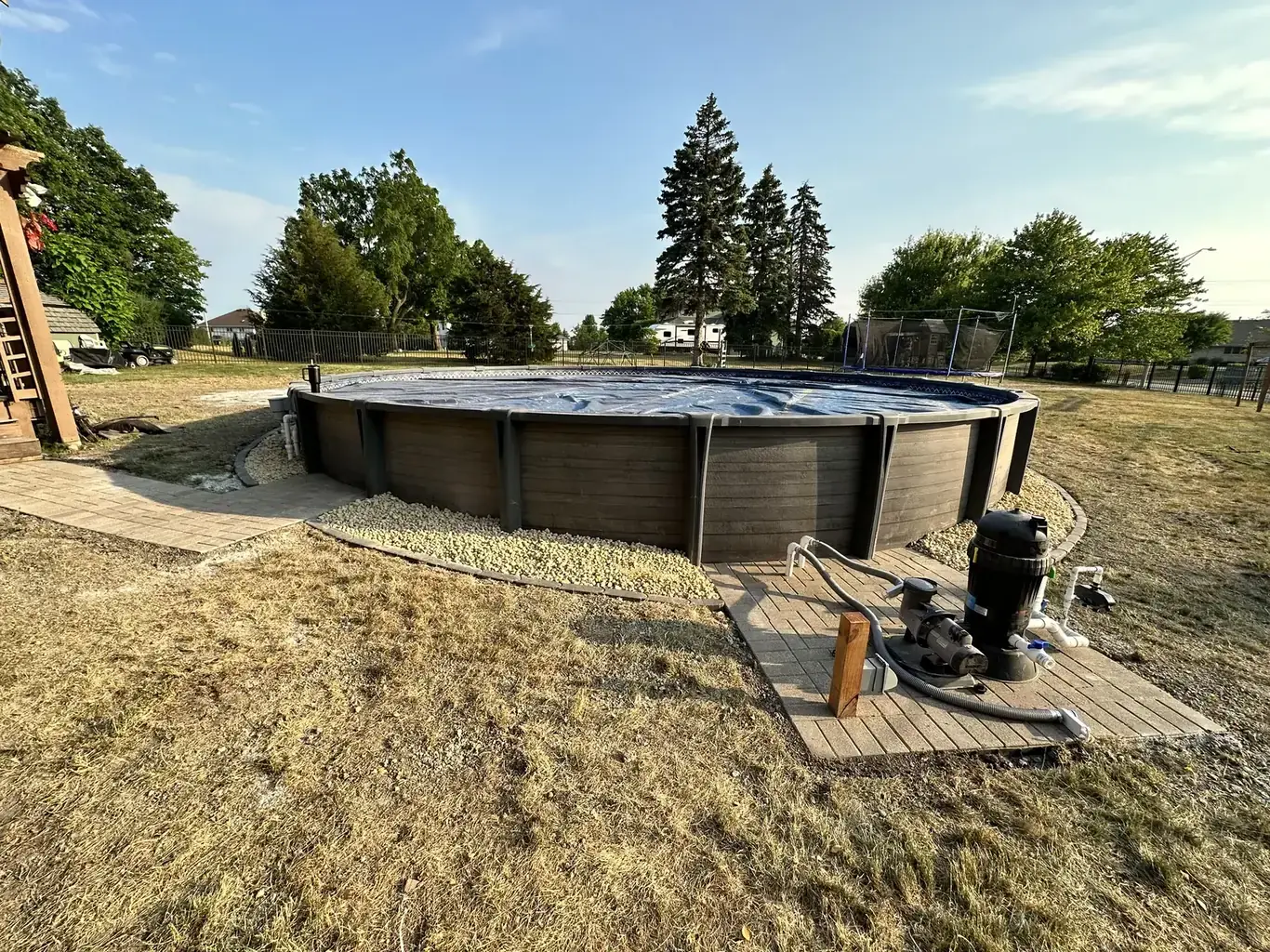 Finished pool patios & surrounds in the southwest suburbs by Rodak Landscaping: Above-Ground Pool with Paver Pad Deck Connection