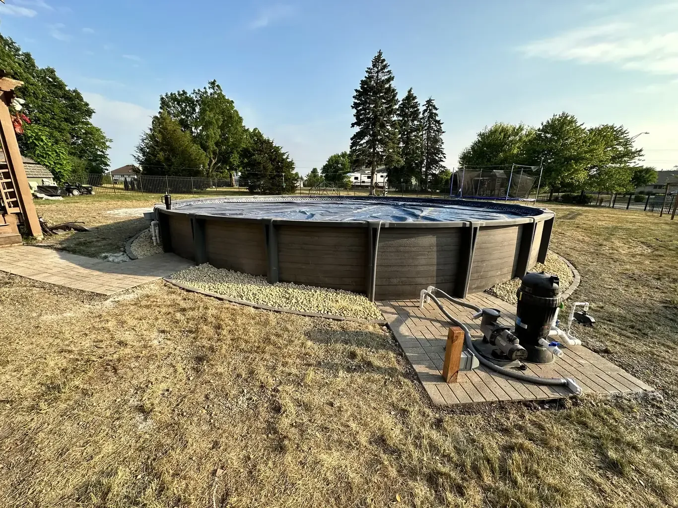 Finished pool patios & surrounds in the southwest suburbs by Rodak Landscaping: Above-Ground Pool with Paver Pad Deck Connection
