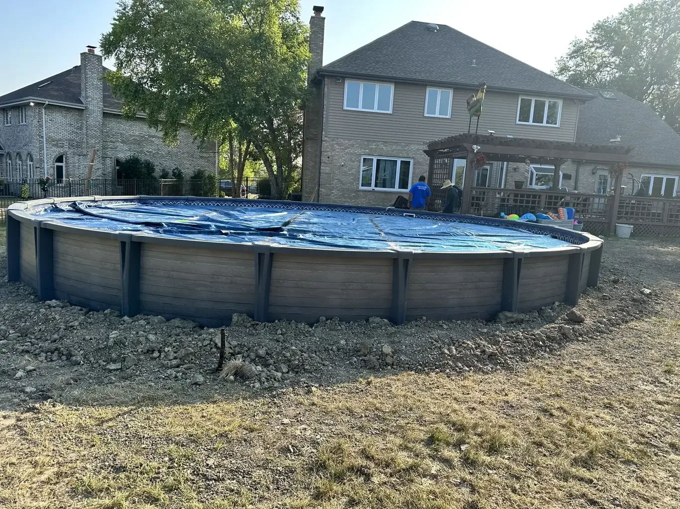 Pool Patios & Surrounds in the southwest suburbs before Rodak Landscaping started: Above-Ground Pool with Paver Pad Deck Connection