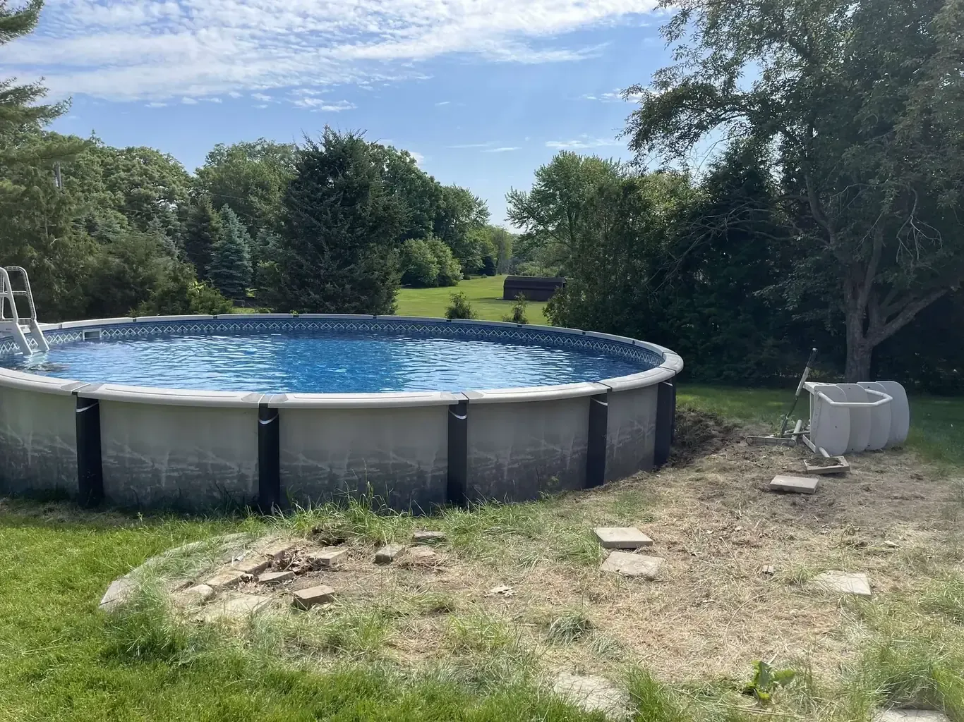Pool Patios & Surrounds in the southwest suburbs before Rodak Landscaping started: Above-Ground Pool with Stone-Border Gravel Pad