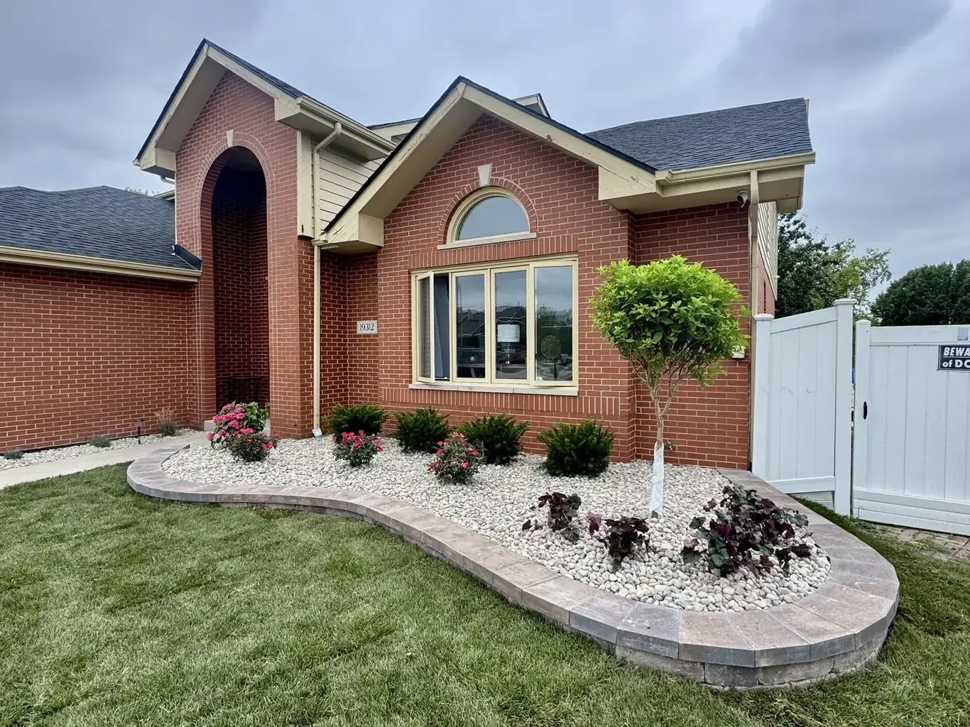 Finished landscape design in Tinley Park by Rodak Landscaping: Tinley Park Curving Bed & Erosion Repair