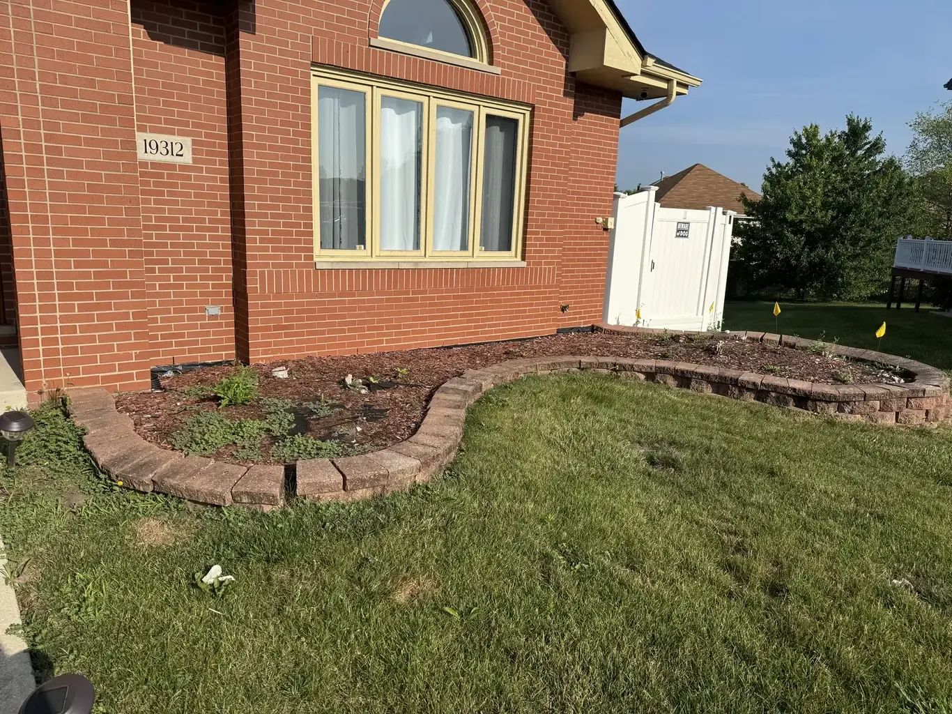 Landscape Design in Tinley Park before Rodak Landscaping started: Tinley Park Curving Bed & Erosion Repair