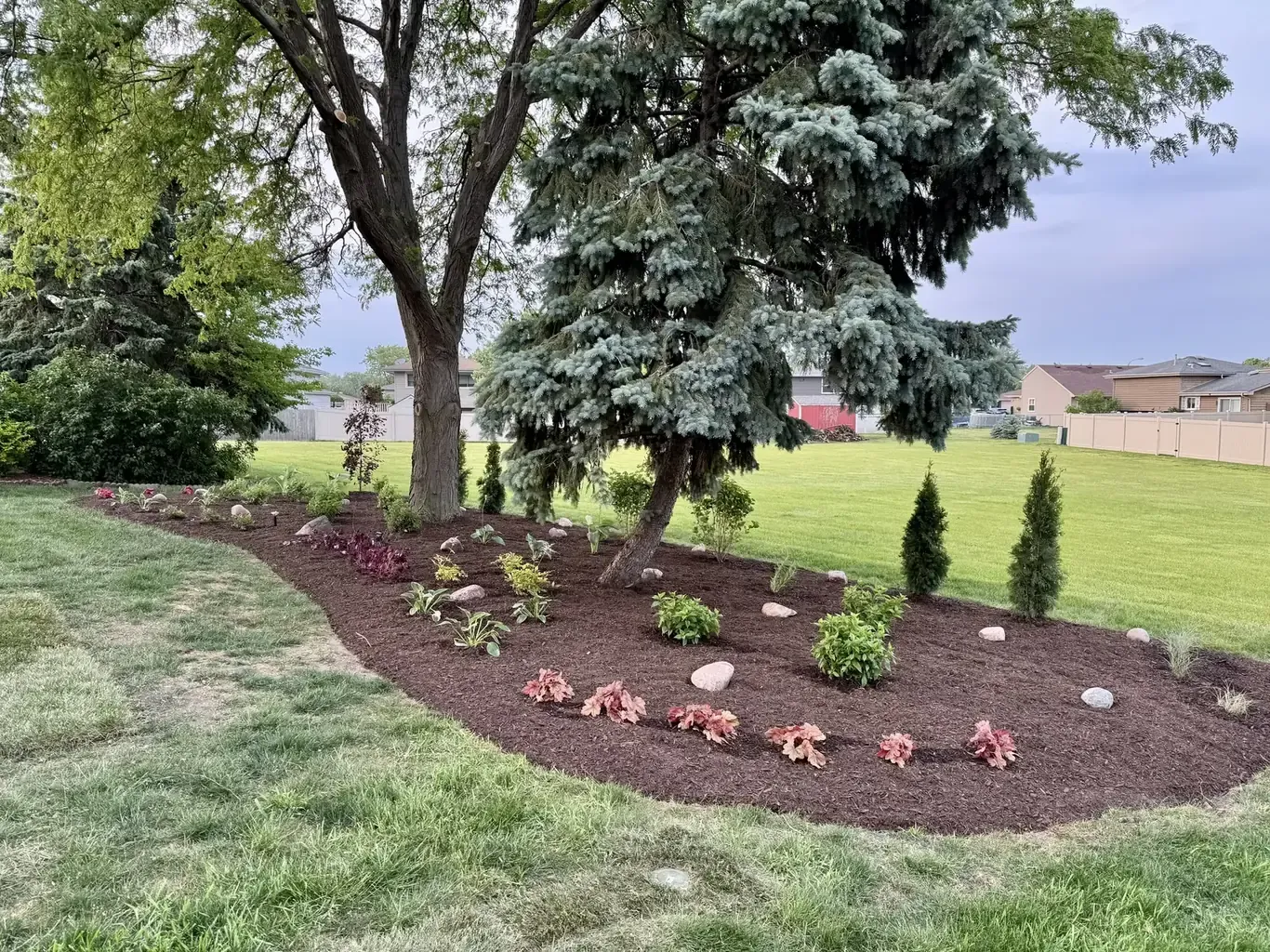 Finished landscape design in Tinley Park by Rodak Landscaping: Tinley Park Backyard Custom Plant & Patio Design